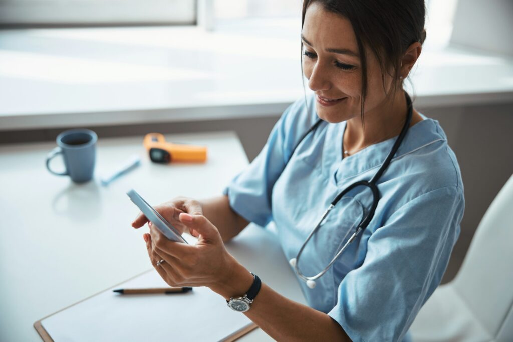 Employee completing mandatory compliance training on a mobile phone